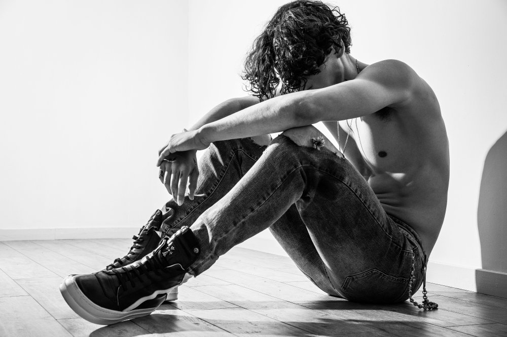 lonely-man-human being-sitting-black-white
